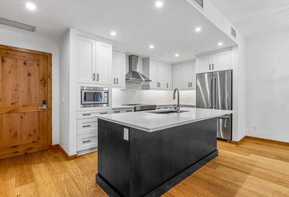 Contemporary kitchen with white and black accents